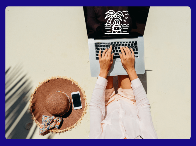 woman working remotely on her laptop at the beach