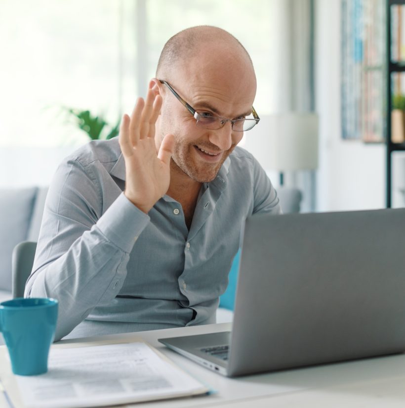 Businessman working from home and video conferencing