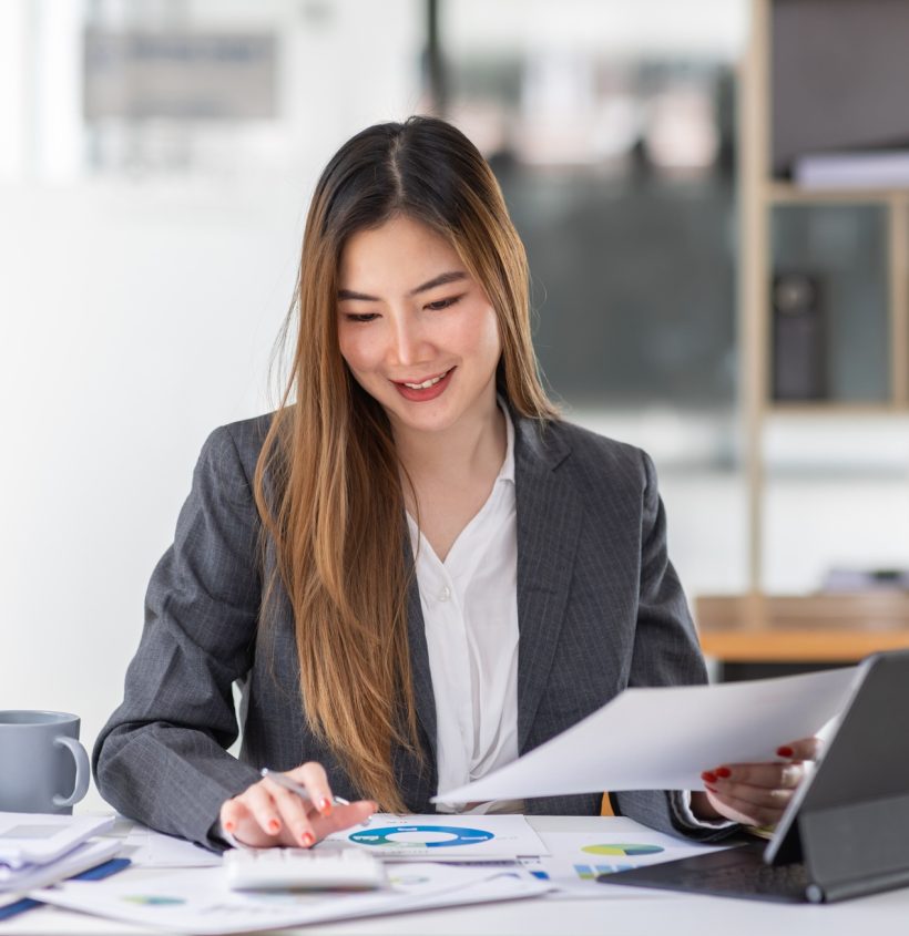 Businesswoman or accountant working Financial investment on calculator, calculate, analyze business