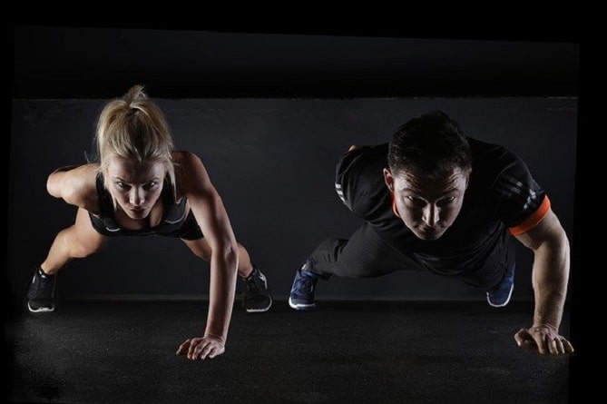 A couple doing a plank