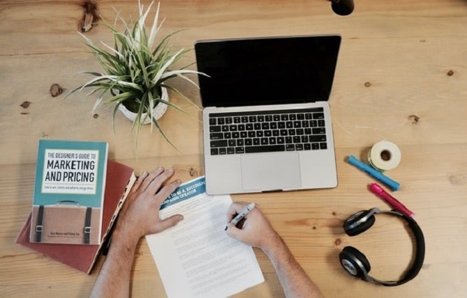 A laptop and a book on the desk