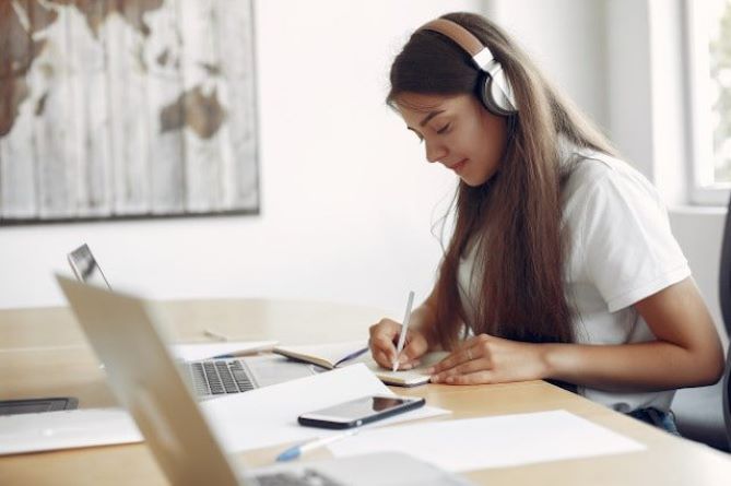 Student learining with headphones on