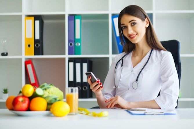 A young dietitian in her office