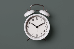 White clock on green background