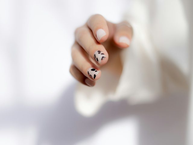 a hand with painted nails