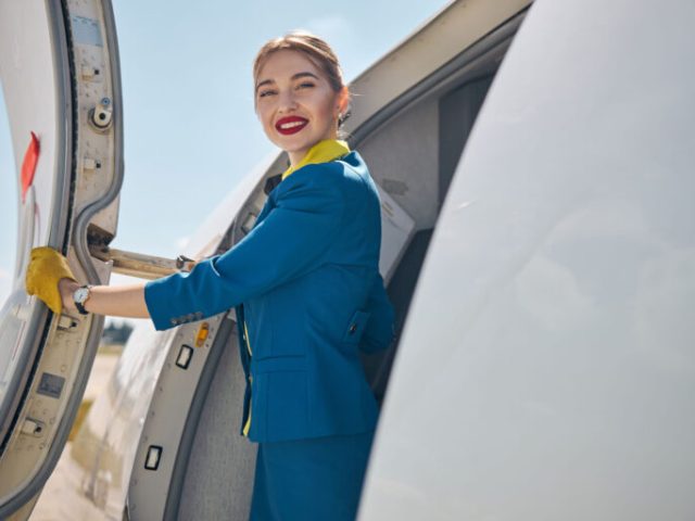 beautiful-flight-attendant-standing-near-airplane-2024-10-18-09-33-21-utc_optimized_1000-768x512