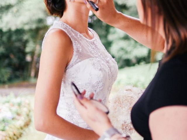 woman in white floral lace tank top and black skirt