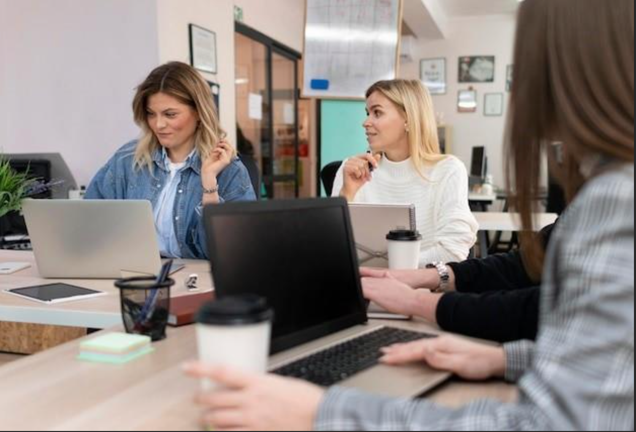 Females going over responsibilities of a Human Resources Department