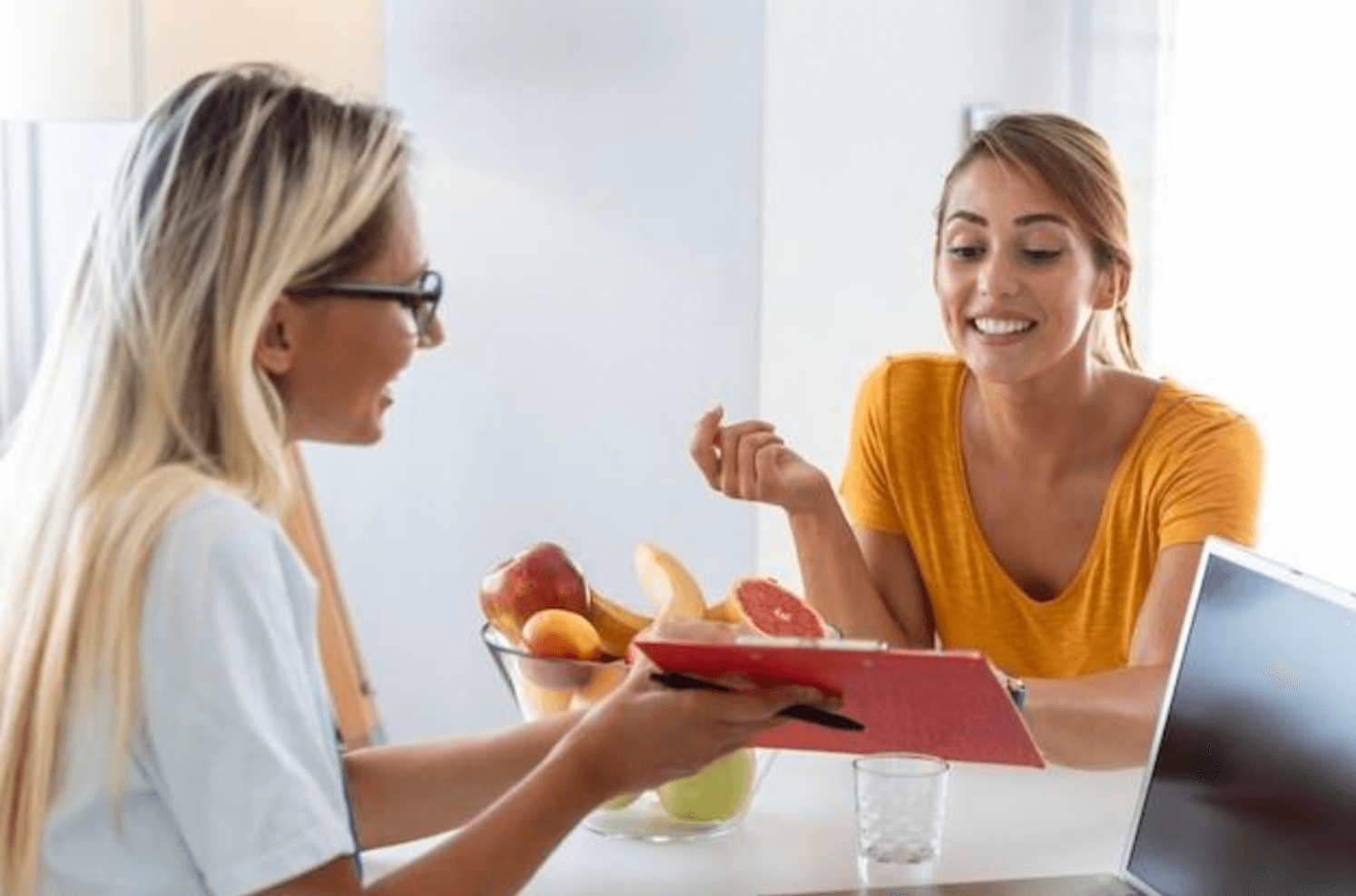 Females looking at chart how to become a nutritionist