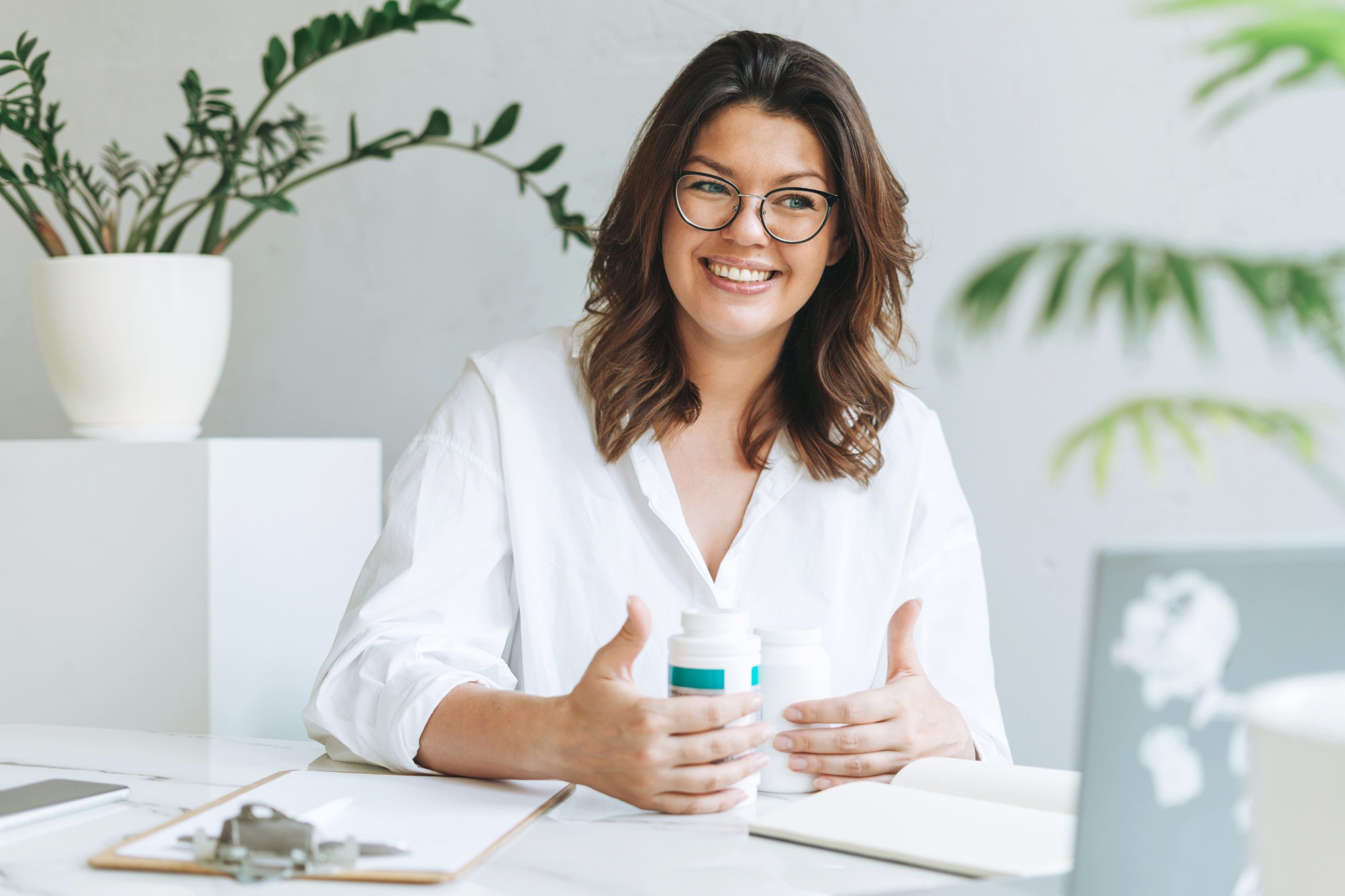 A female nutritionist smiling during an online consultation