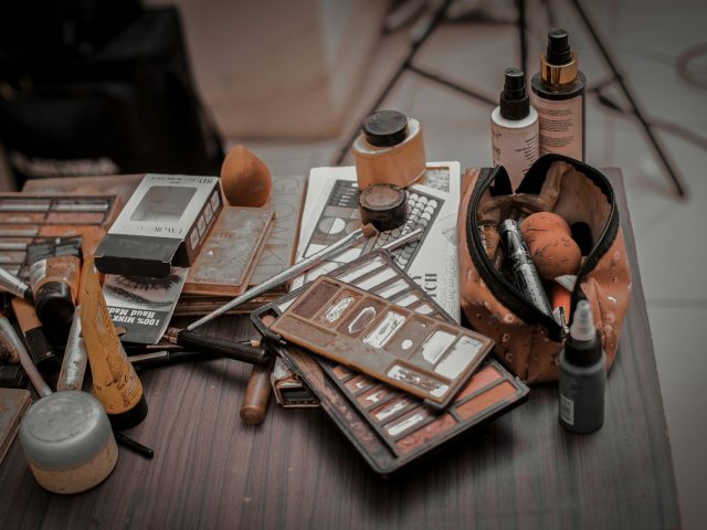 a wooden table topped with lots of different items