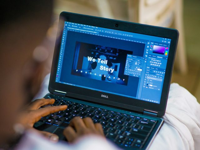 person using black laptop computer