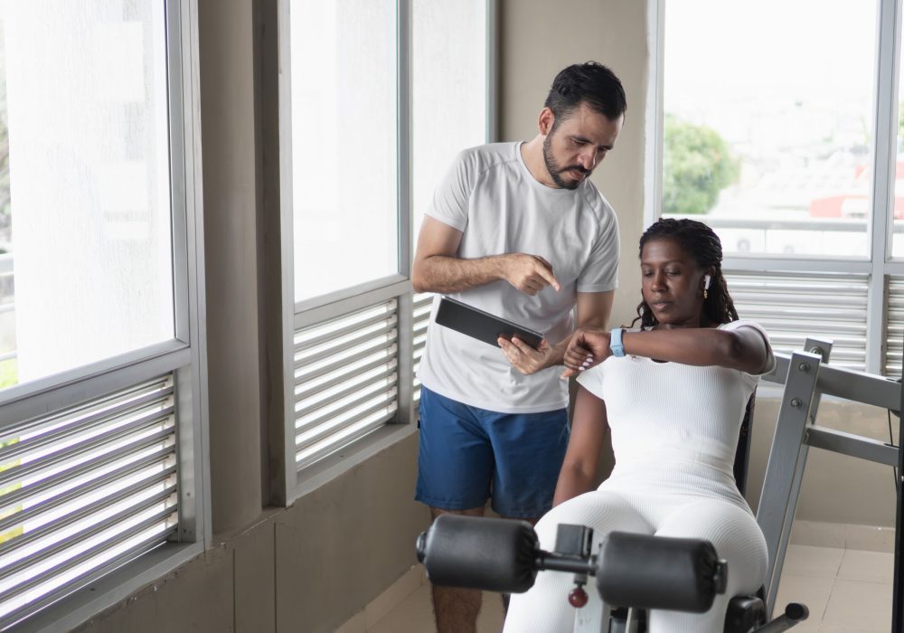 personal-trainer-showing-tablet-to-client-checking-2025-05-26-10-12-15-utc_optimized_1000
