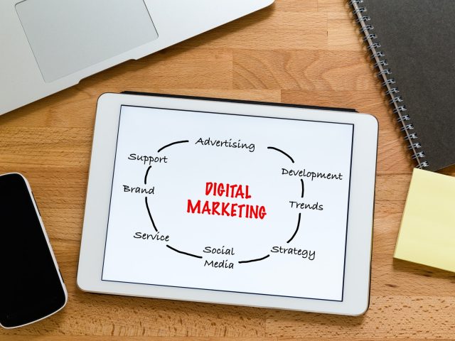 working-desk-with-digital-tablet-showing-digital-marketing-concept.jpg